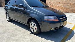 Aveo Sedan 1.6. Gris Oscuro. Aire Acondicionado. Excelente Estado